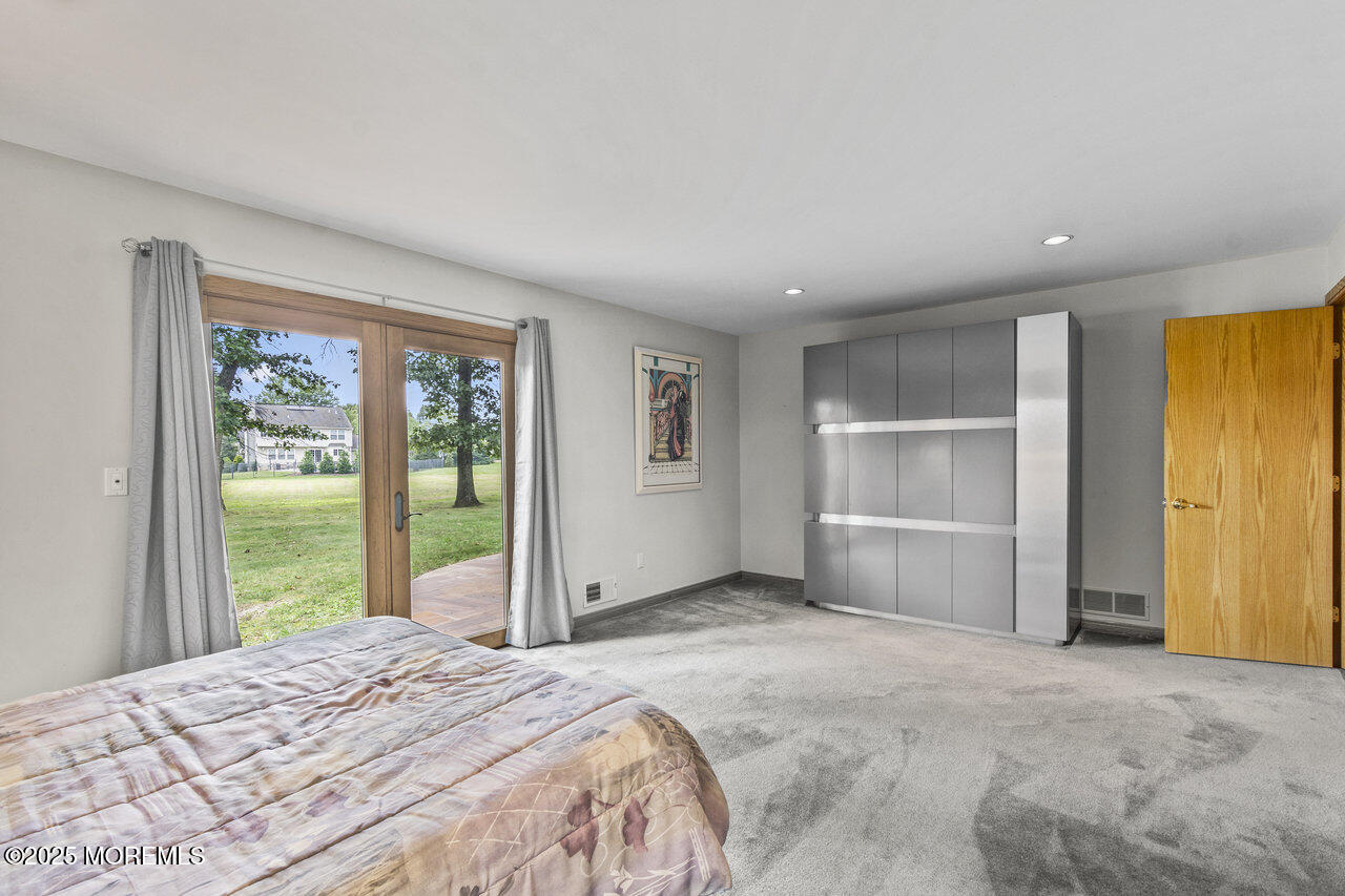 31 Thompson Grove Road Freehold, NJ 07728 - Photo 45 of 54 a bedroom with a bed and a large window