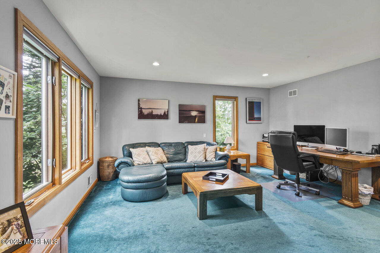 31 Thompson Grove Road Freehold, NJ 07728 - Photo 46 of 54 a living room with furniture a rug and a large window