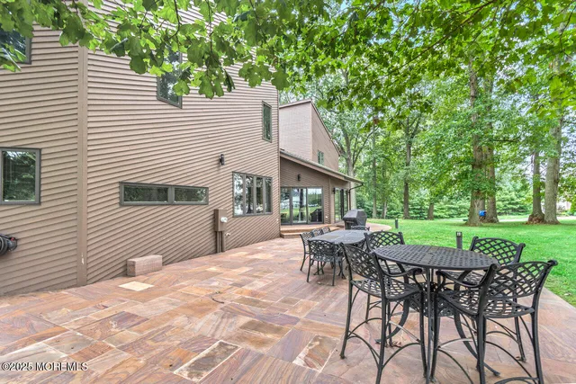 a backyard of a house with seating space