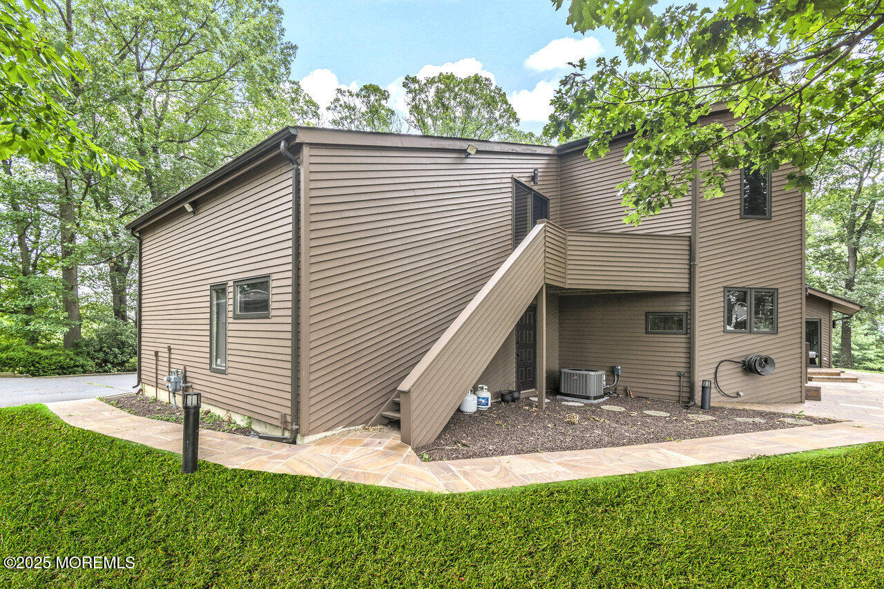 31 Thompson Grove Road Freehold, NJ 07728 - Photo 8 of 54 a view of a house with a yard and tree