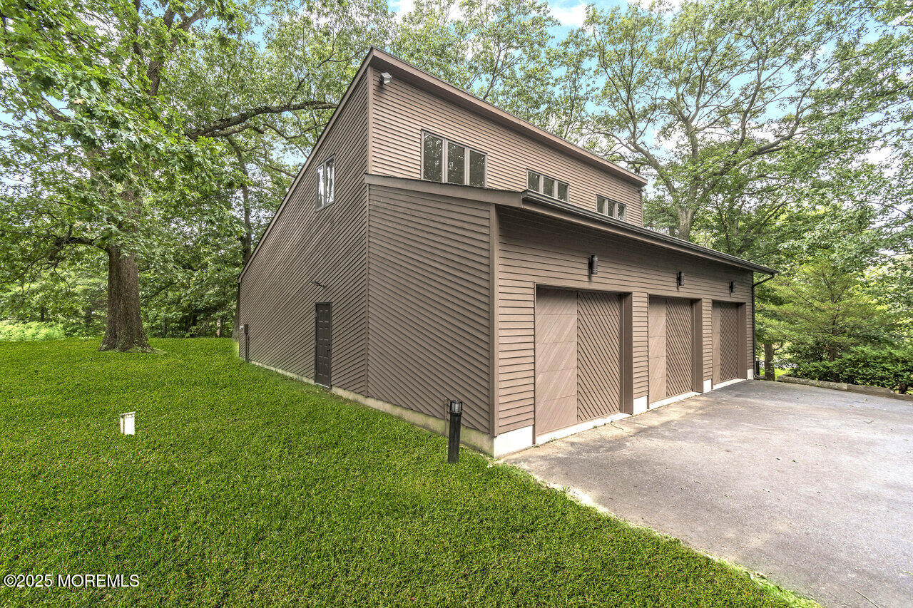 31 Thompson Grove Road Freehold, NJ 07728 - Photo 9 of 54 a front view of a house with garden