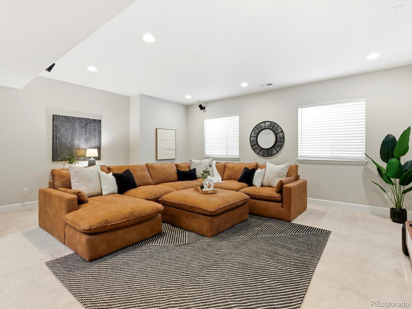 6579 South Vaughn Street Centennial, CO 80111 - Photo 31 of 44 a living room with furniture and a rug