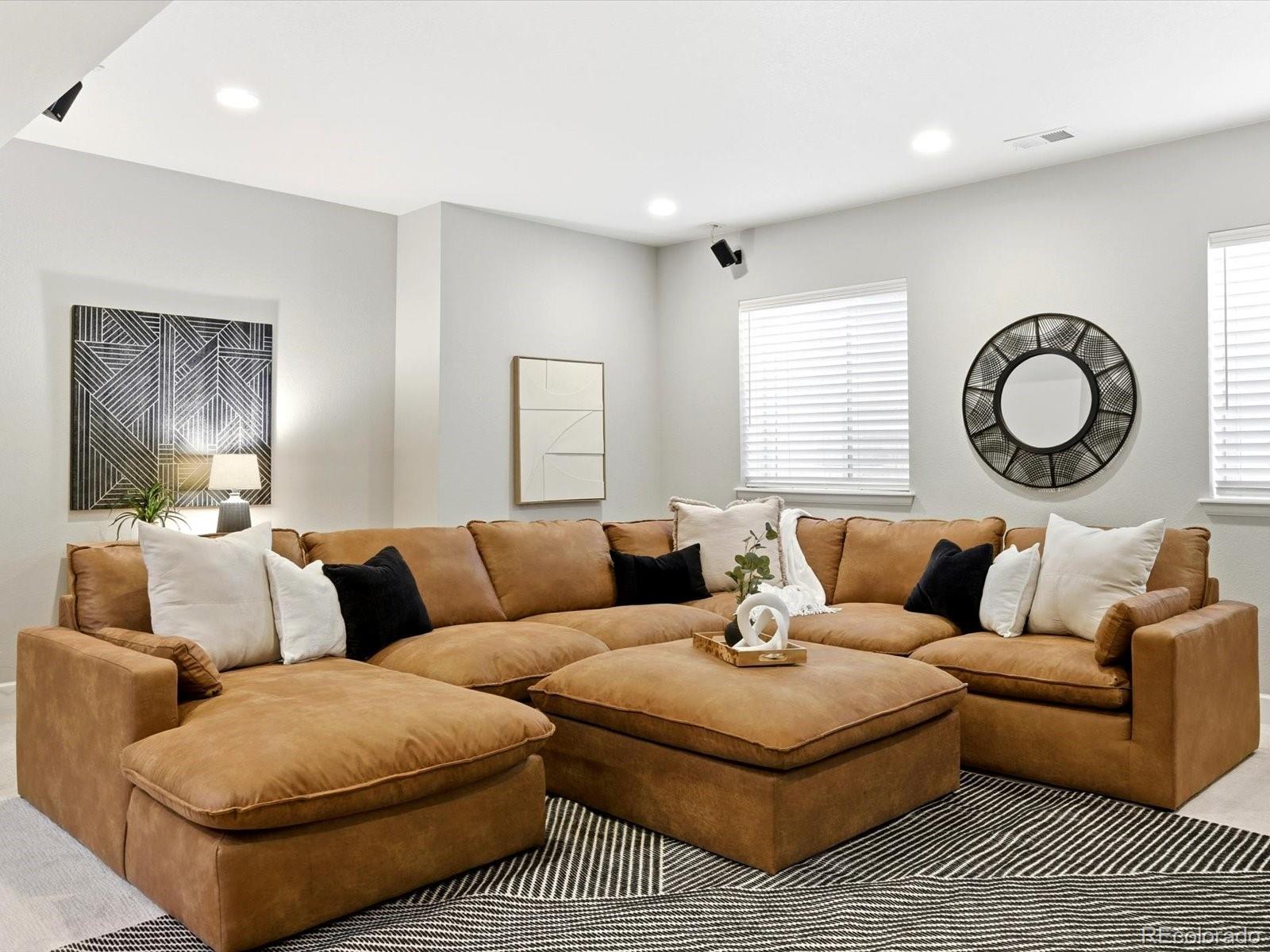 6579 South Vaughn Street Centennial, CO 80111 - Photo 32 of 44 a living room with furniture and a large window