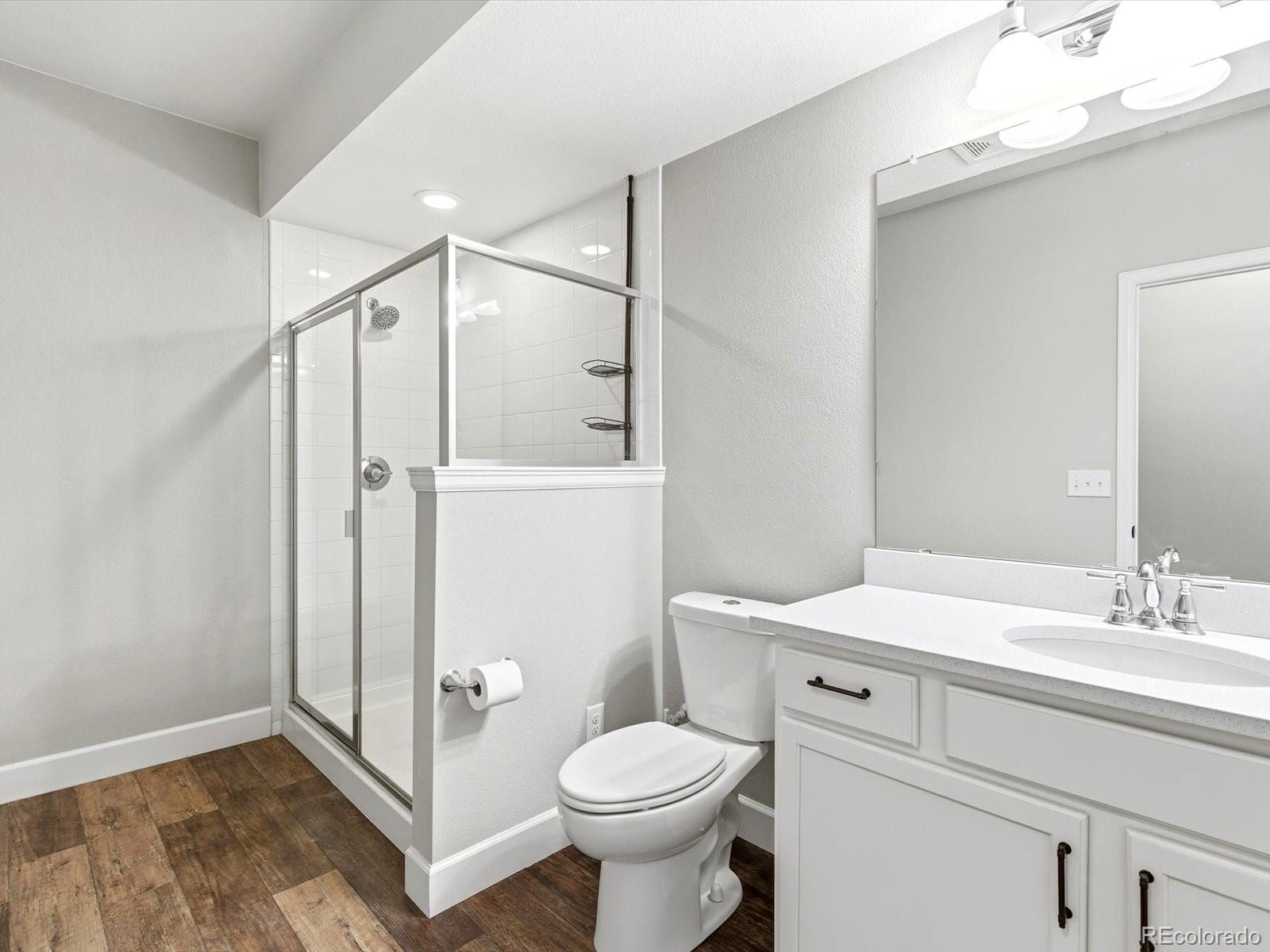 6579 South Vaughn Street Centennial, CO 80111 - Photo 40 of 44 a bathroom with a sink toilet and shower