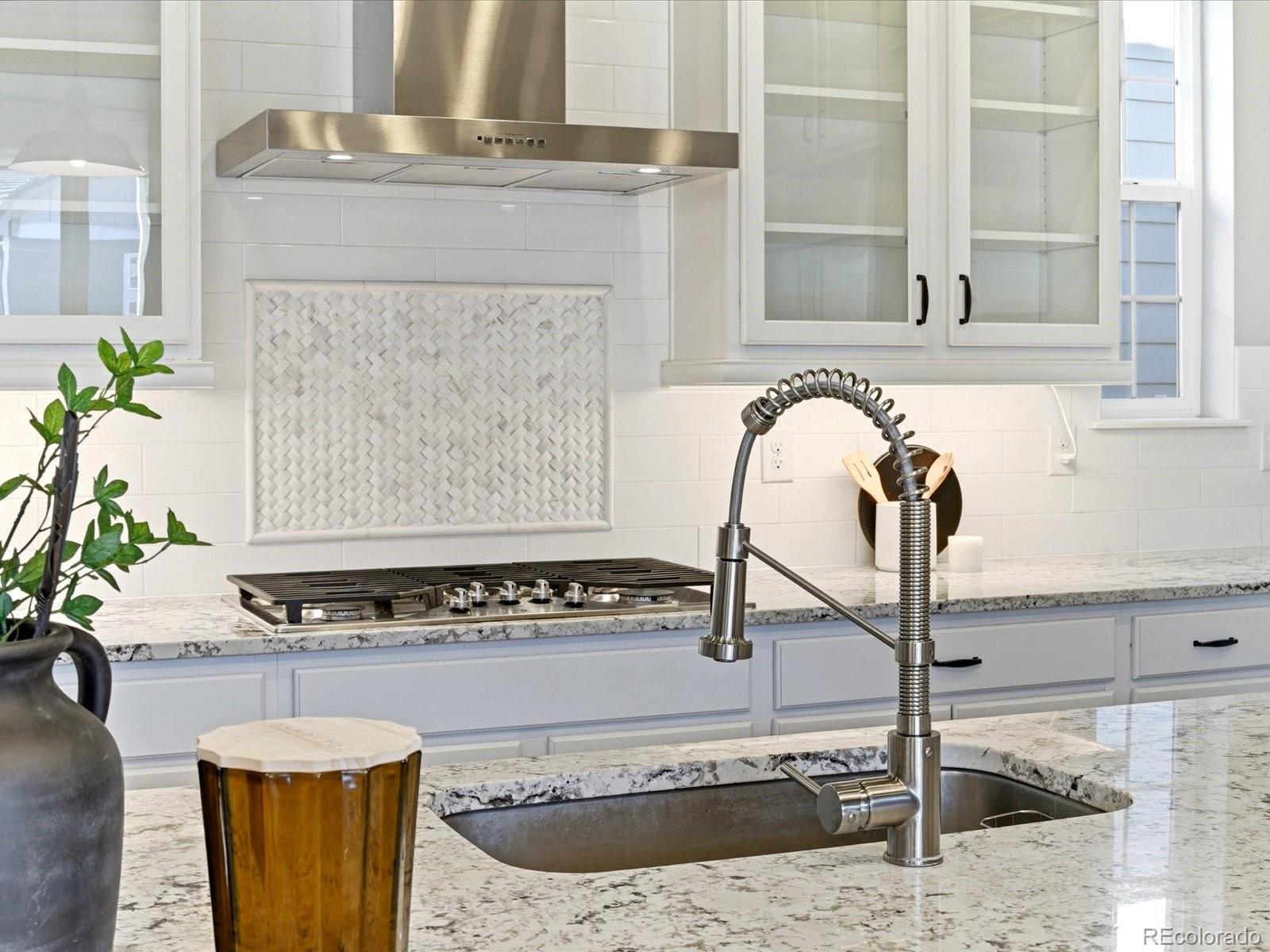 6579 South Vaughn Street Centennial, CO 80111 - Photo 7 of 44 a view of a kitchen with sink and faucet