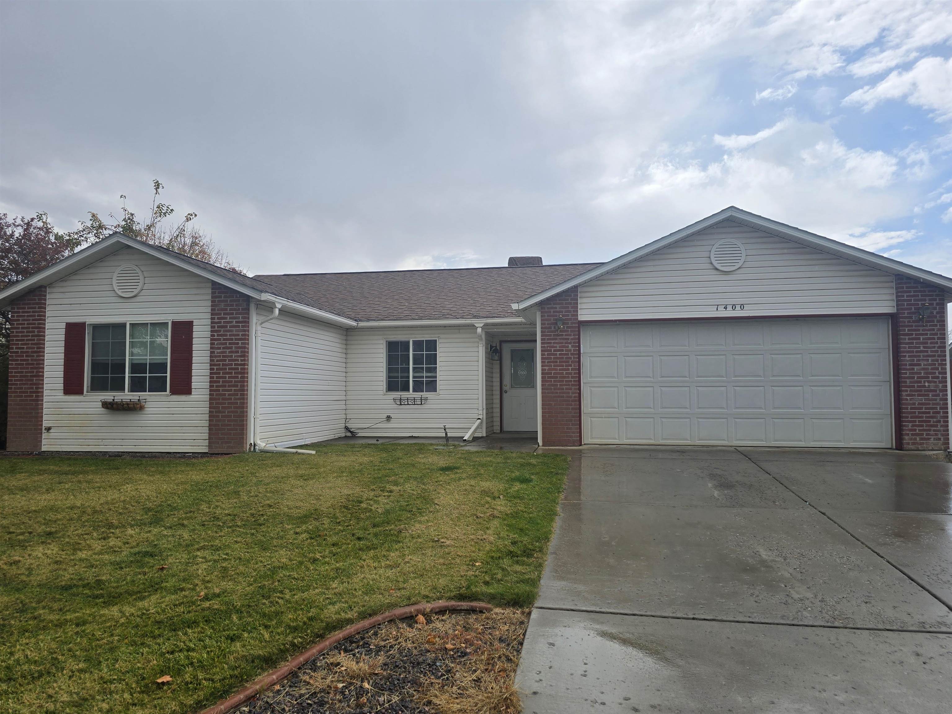 a house view with a garden space