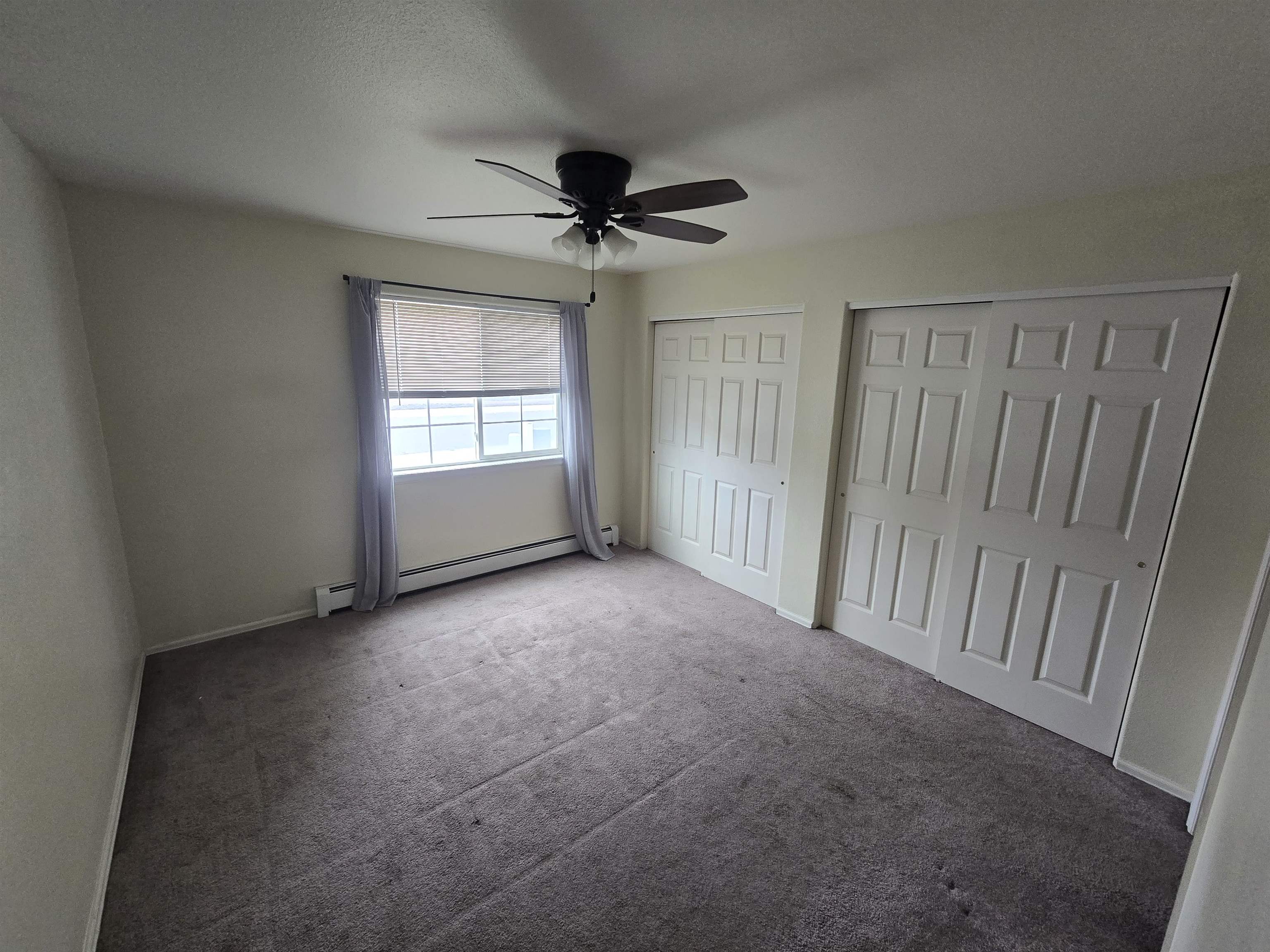 1400 Powell Street Fruita, CO 81521 - Photo 11 of 21 a view of a livingroom with a ceiling fan and window