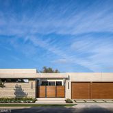 an aerial view of a houses with ocean view