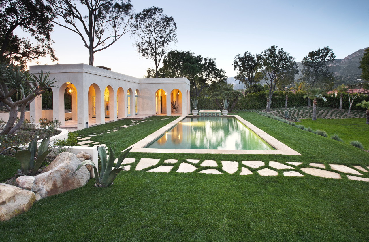 a swimming pool view with a outdoor seating