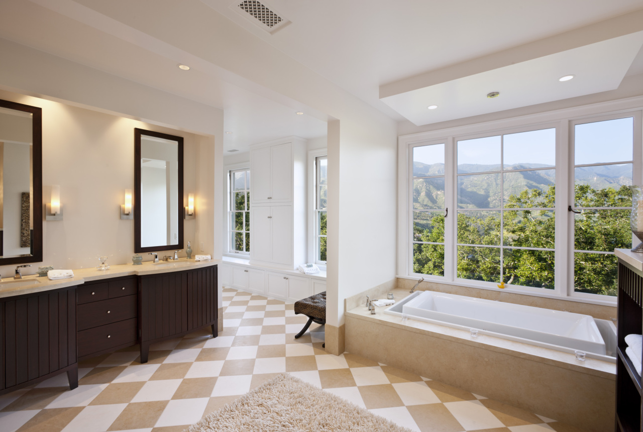 1041 Mission Ridge Road Santa Barbara, CA 93103 - Photo 5 of 11 a spacious bathroom with a bathtub and a double vanity sink mirror