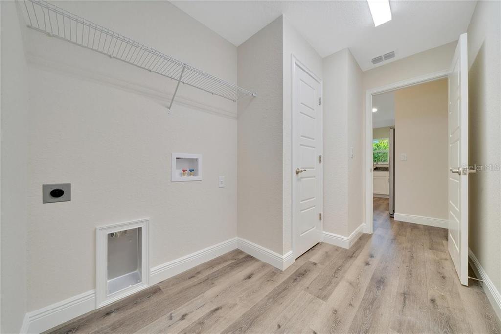 10675 Southwest 69th Terrace Ocala, FL 34476 - Photo 21 of 48 a view of empty room with wooden floor