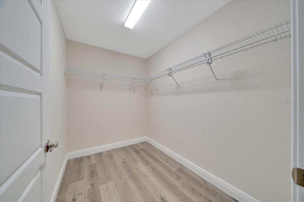 10675 Southwest 69th Terrace Ocala, FL 34476 - Photo 28 of 48 a view of a room with wooden floor