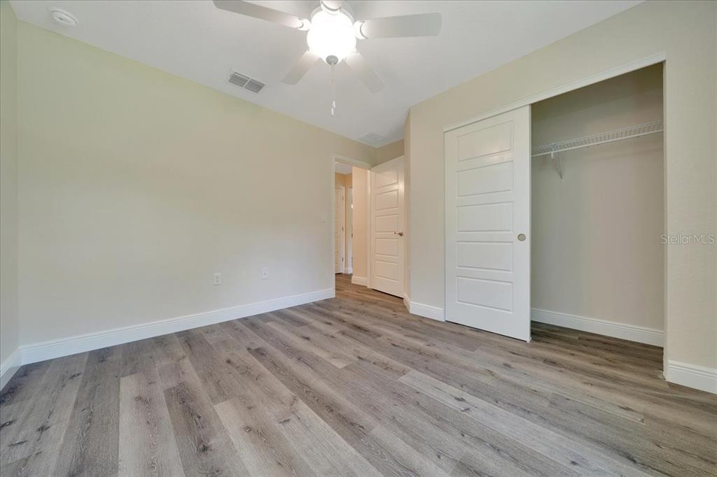 10675 Southwest 69th Terrace Ocala, FL 34476 - Photo 33 of 48 wooden floor in an empty room