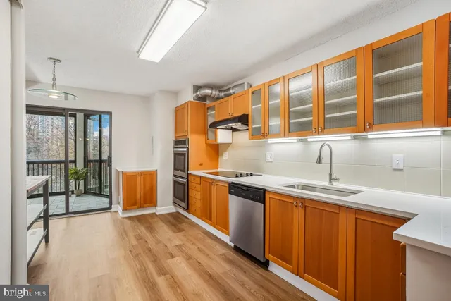 a white toilet sitting next to a bath tub