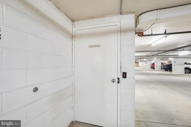 a bathroom with a glass shower door