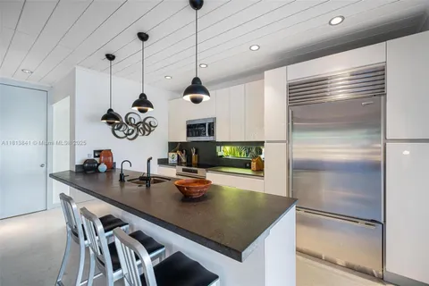 a view of backyard with sitting area