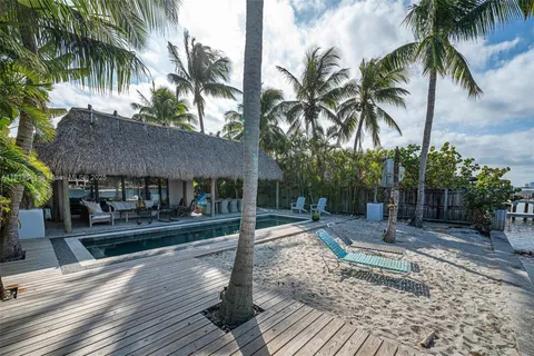 a terrace with outdoor seating and city view