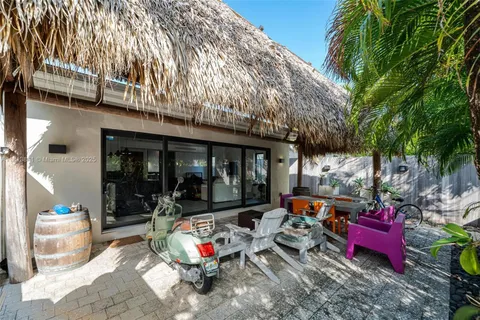 a living room with furniture fireplace and a window