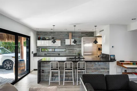 a bed room with a bed and a large window