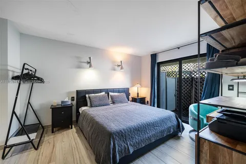 a kitchen with stainless steel appliances granite countertop a sink a stove and a wooden floors