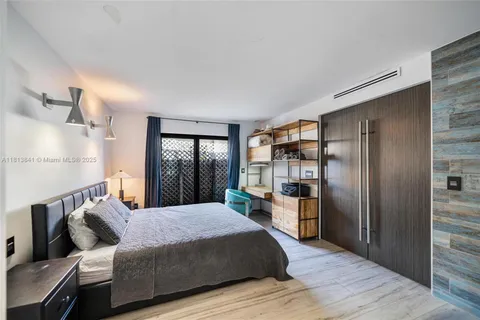 an aerial view of lake residential houses with outdoor space and trees