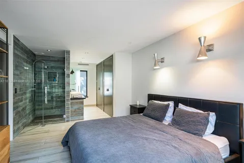 an aerial view of a houses with two chairs