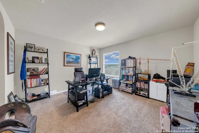 a room with furniture and gym equipment