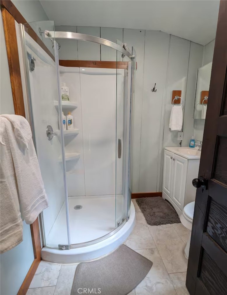 16135 Bottle Rock Road Cobb, CA 95426 - Photo 11 of 19 a bathroom with a glass shower door
