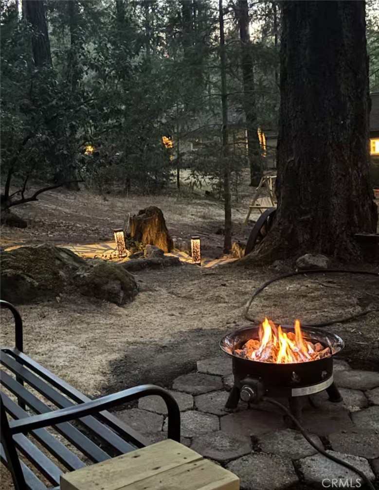 16135 Bottle Rock Road Cobb, CA 95426 - Photo 16 of 19 a view of a swimming pool with a patio