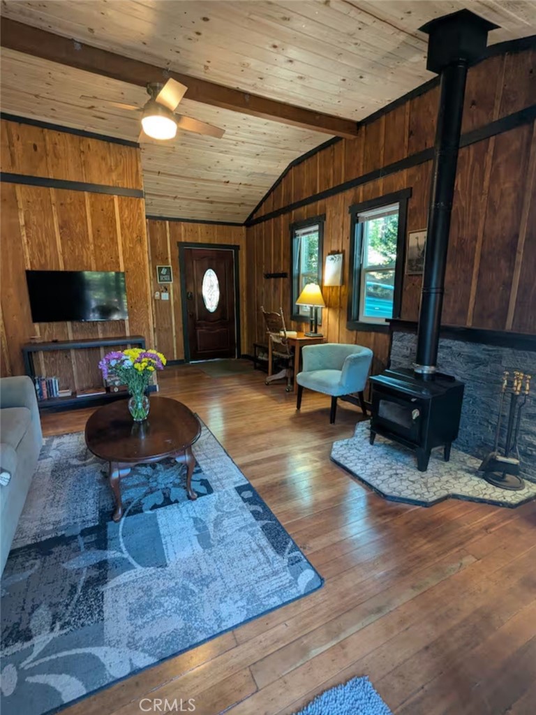 16135 Bottle Rock Road Cobb, CA 95426 - Photo 19 of 19 a living room with fireplace furniture and a flat screen tv