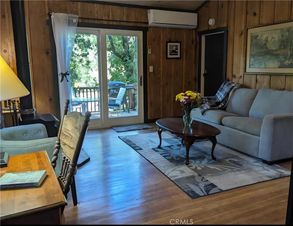 16135 Bottle Rock Road Cobb, CA 95426 - Photo 2 of 19 a living room with furniture rug and wooden floor
