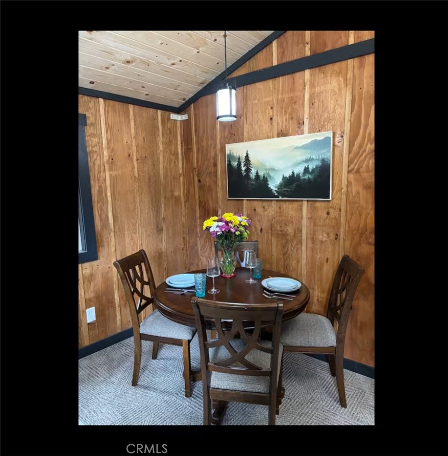 16135 Bottle Rock Road Cobb, CA 95426 - Photo 7 of 19 a view of a dining room with furniture and wooden floor