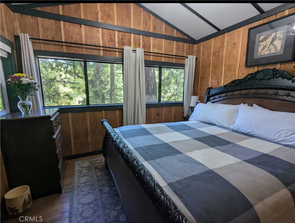 16135 Bottle Rock Road Cobb, CA 95426 - Photo 8 of 19 a bedroom with a bed and a large window