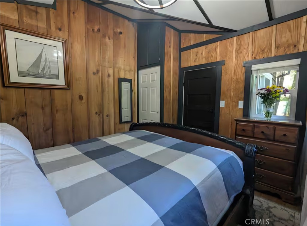 16135 Bottle Rock Road Cobb, CA 95426 - Photo 9 of 19 a bedroom with a bed cabinets and a window