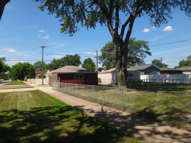 4044 Clinton Avenue Stickney, IL 60402 - Photo 11 of 11 a front view of a house with garden