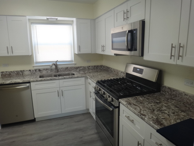 4044 Clinton Avenue Stickney, IL 60402 - Photo 5 of 11 a kitchen with granite countertop cabinets stainless steel appliances and a sink