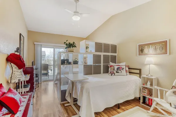 a bedroom with furniture and a book shelf