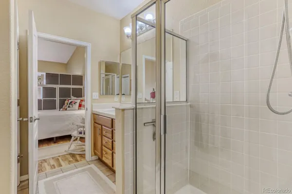 a bathroom with a tub and shower