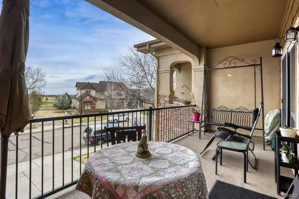 a view of balcony with furniture
