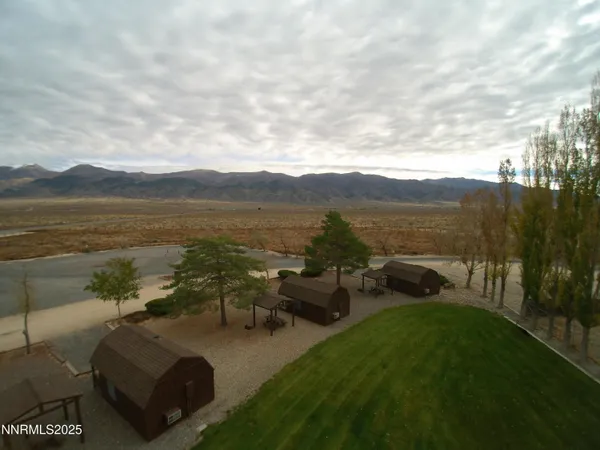 a view of a lake with couches in the patio