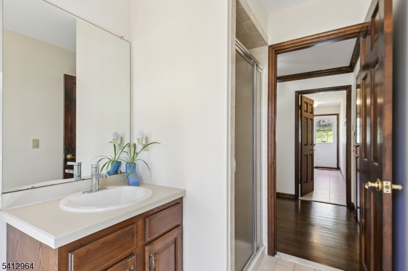 34 Knollcroft Road Bernards, NJ 07920 - Photo 17 of 34 a bathroom with a sink and a mirror