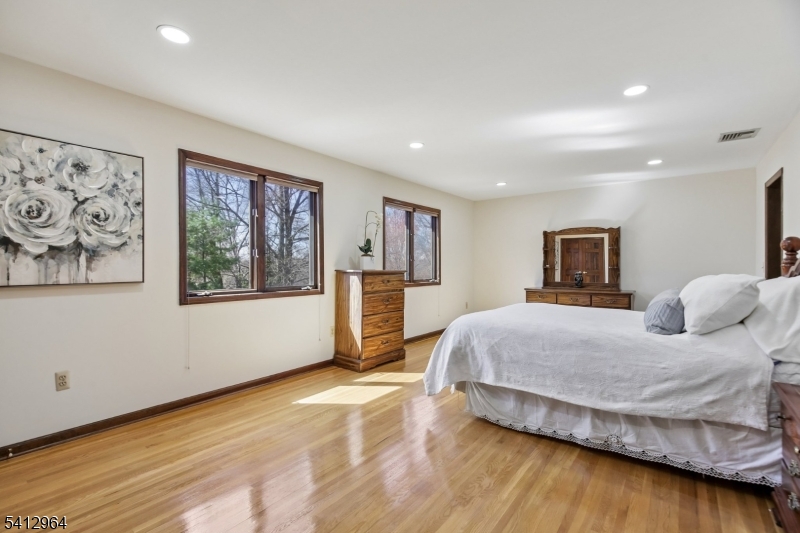 34 Knollcroft Road Bernards, NJ 07920 - Photo 20 of 34 a bedroom with a large bed and a couch