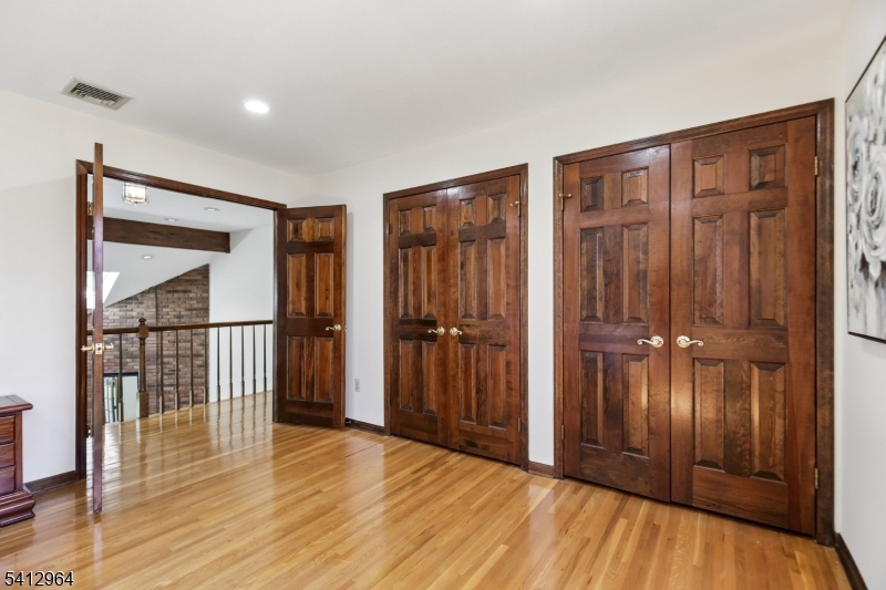 34 Knollcroft Road Bernards, NJ 07920 - Photo 21 of 34 a view of a hallway with wooden floor