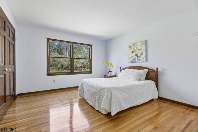 34 Knollcroft Road Bernards, NJ 07920 - Photo 24 of 34 a bedroom with a bed and a window