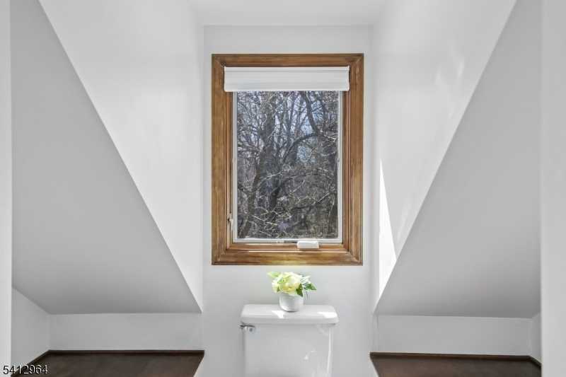 34 Knollcroft Road Bernards, NJ 07920 - Photo 27 of 34 a living room with a window and a table