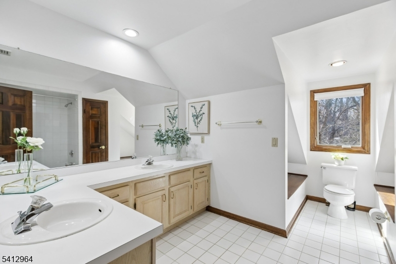 34 Knollcroft Road Bernards, NJ 07920 - Photo 28 of 34 a bathroom with a sink and a mirror