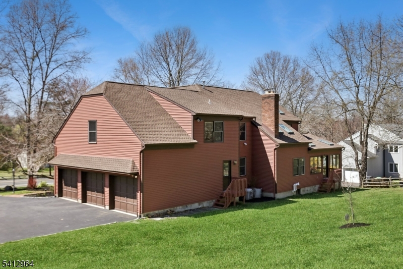 34 Knollcroft Road Bernards, NJ 07920 - Photo 31 of 34 a front view of house with a garden