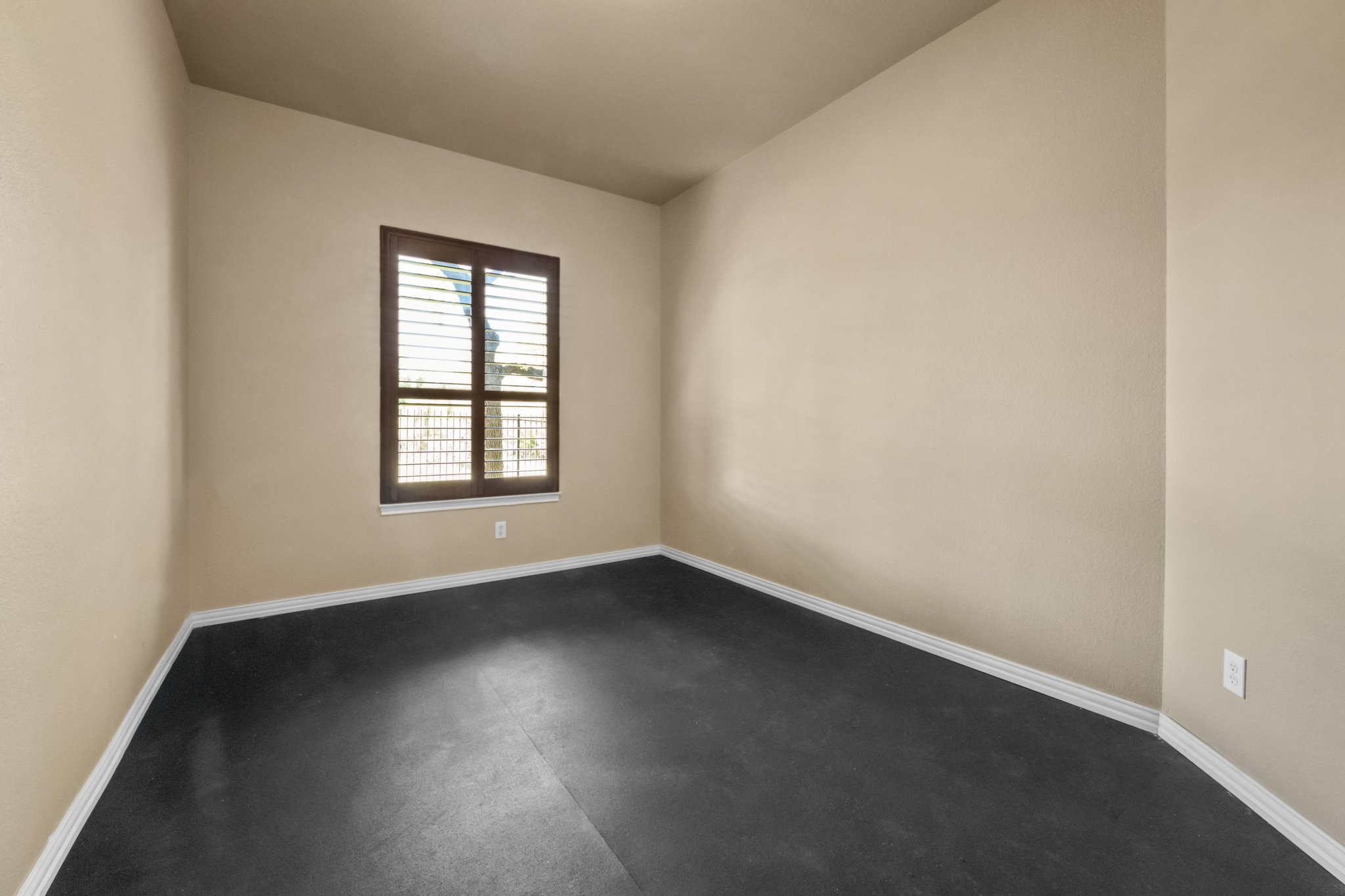 22204 Red Yucca Road Spicewood, TX 78669 - Photo 15 of 34 an empty room with wooden floor and windows