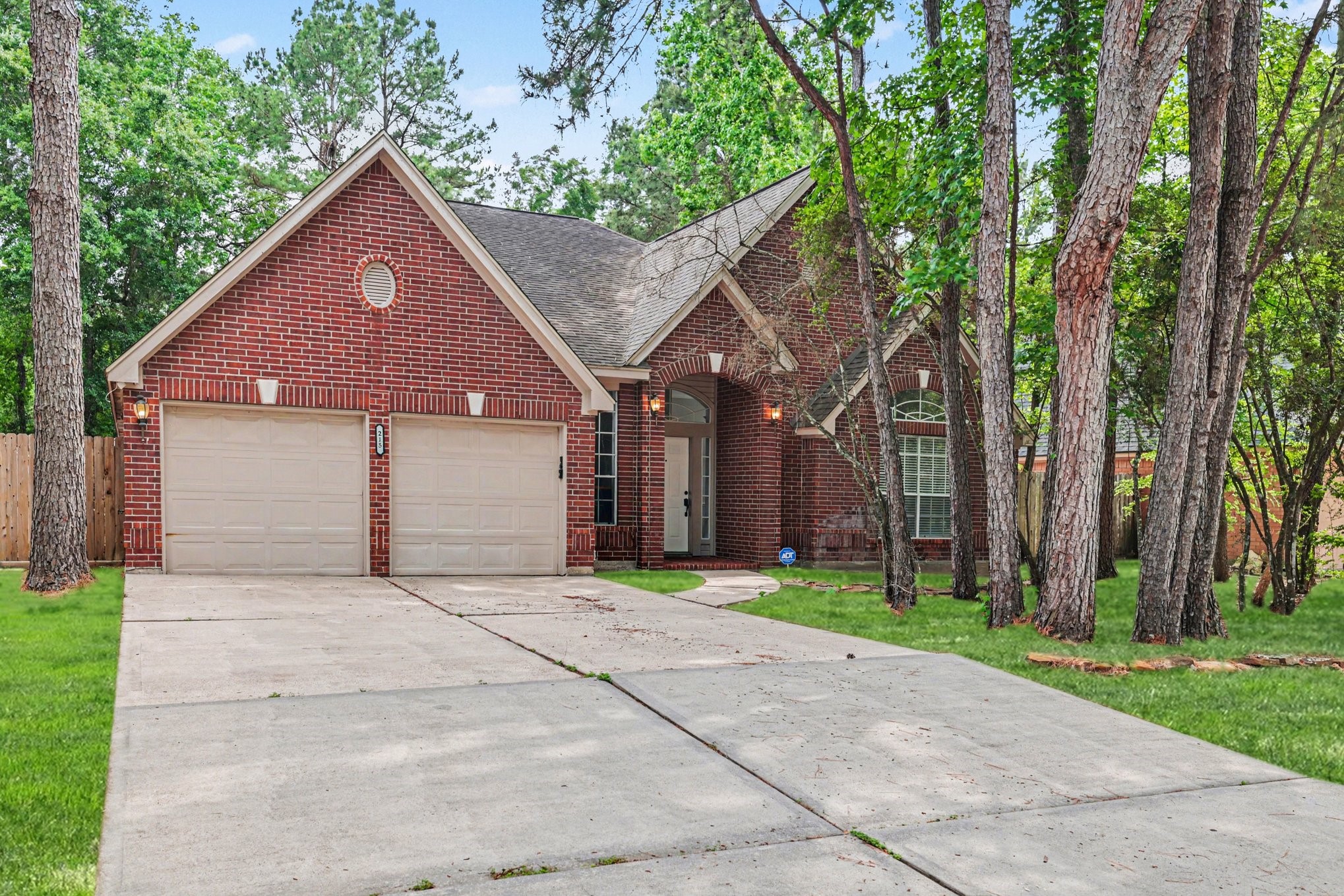215 Bristol Bend Circle Spring, TX 77382 - Photo 1 of 25 a front view of a house with a yard and garage