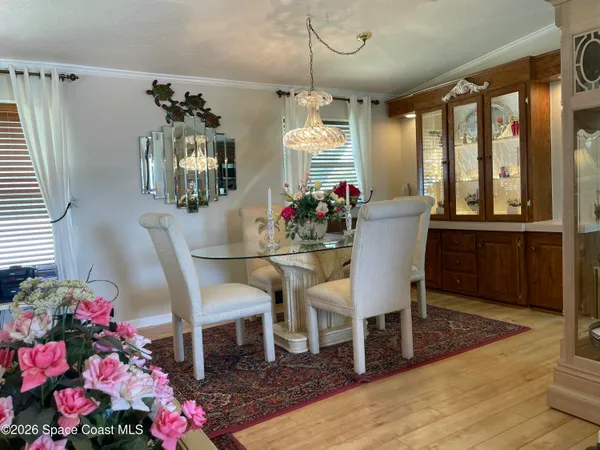 a kitchen with stainless steel appliances granite countertop a sink a stove and a wooden cabinets